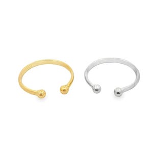 May include: Two simple rings with small ball ends. One ring is gold and the other is silver.