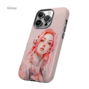 May include: A pink phone case with a design of a woman with pink hair wearing headphones. The case has a glossy finish and a camera bump with three lenses.