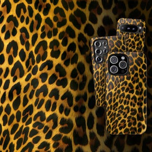 May include: Three phone cases with a leopard print design. The cases are black and gold with a brown and black leopard print pattern.