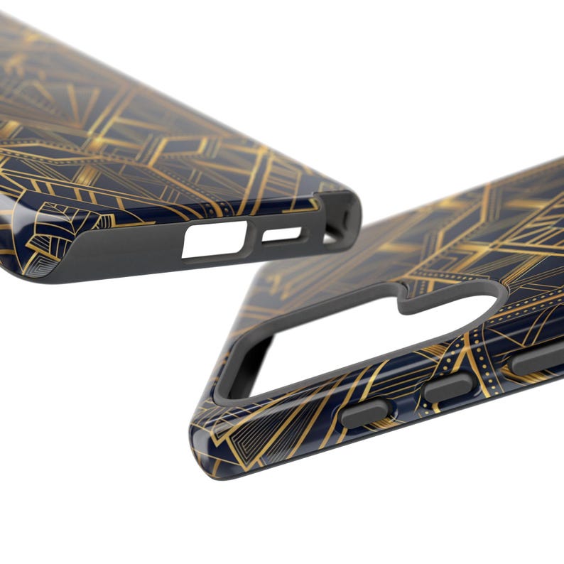 May include: Two phone cases with a navy blue and gold art deco design. The cases have a glossy finish and a black border. The gold design features geometric shapes and lines. The cases are shown at an angle, highlighting the design and the cutouts for the phone's features.
