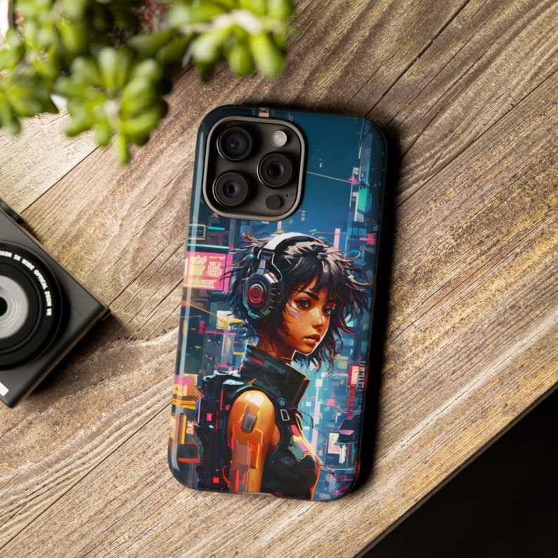 May include: A phone case with a colourful cyberpunk design featuring a woman with headphones and a futuristic cityscape in the background.