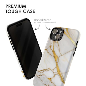 May include: A white and gold marble phone case with raised bezels for screen and camera protection.  "Premium Tough Case" is written at the top of the image.