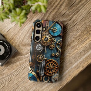 May include: A phone case with a steampunk design featuring intricate gold and silver gears on a blue background.