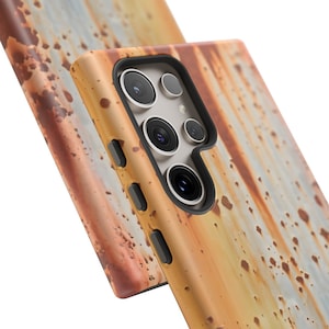 May include: A phone case with a rusty metal design. The case is made of a durable material and has a raised camera bump to protect the phone's lenses.
