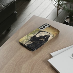May include: A black phone case with a graphic of the Grim Reaper holding a scythe. The background is a faded yellow and brown watercolor design.