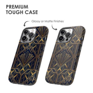 May include: Two phone cases with a geometric art deco design in gold and navy blue. The text "PREMIUM TOUGH CASE" is at the top. One case has a glossy finish, the other a matte finish.