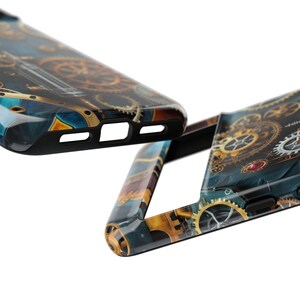 May include: Two phone cases with a steampunk design featuring intricate gears and a blue and gold colour scheme.