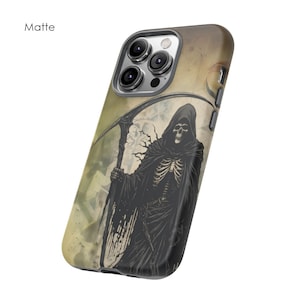 May include: A matte black phone case with a graphic of a skeletal figure in a hooded robe holding a scythe. The background is a faded, textured design.