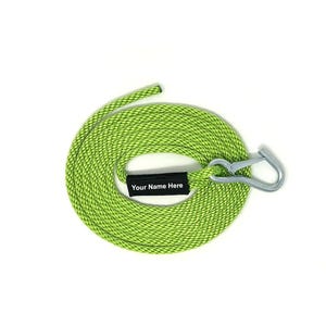 May include: A lime green rope dog leash with a black personalized tag that says "Your Name Here" and a silver hook.