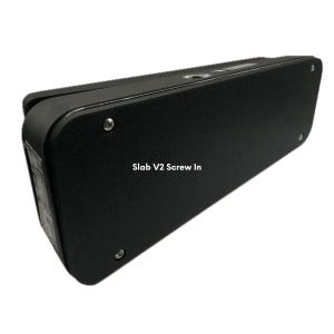 May include: A black rectangular device with rounded edges, featuring the text "Slab V2 Screw In." The device has a textured surface and is secured with multiple screws. The overall design is sleek and modern.