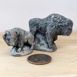Pair of 2 Mt. St. Helens sculptures hand crafted volcanic ash bison buffalo figurine