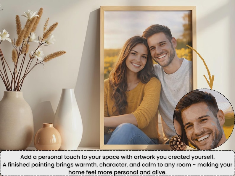 May include: A framed print featuring a smiling couple, with a smaller circular portrait of the man. The frame is light-colored, and the image is displayed with decorative vases and dried flowers.