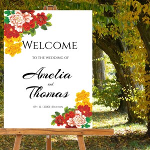 Pode incluir: Placa de boas-vindas com flores vermelhas e amarelas, com o texto "Bem-vindos ao casamento de Amelia e Thomas, 09-16-20XX, Houston."