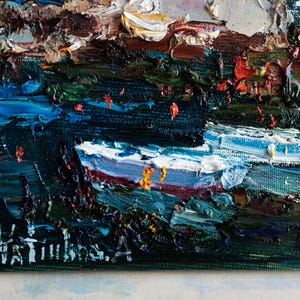 May include: Close-up of an oil painting with impasto brushstrokes. The artwork depicts a landscape with dark blues, greens, and whites. The artist's signature is visible in the lower left corner. The painting is on a canvas.