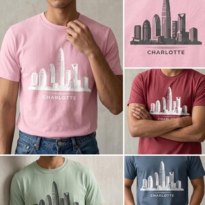 May include: A collection of short-sleeve crew neck t-shirts in light pink, dark red, sage green, and navy blue. Each shirt features a white or dark gray graphic print of the Charlotte city skyline with the word CHARLOTTE printed underneath.