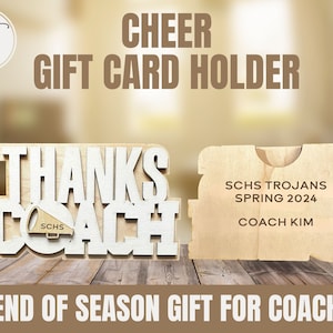 May include: Wooden gift card holder with the words "Thanks Coach" and a small megaphone with the letters "SCHS". The holder is designed to hold a gift card and has a slot for the card. The holder also has the text "SCHS Trojans Spring 2024 Coach Kim".