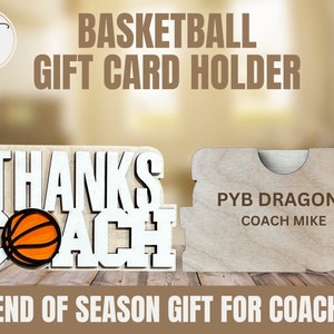 May include: Wooden gift card holder shaped like a basketball with the words "Thanks Coach" and a basketball graphic. The holder also has a separate piece with the text "PYB Dragons Coach Mike" for personalization.
