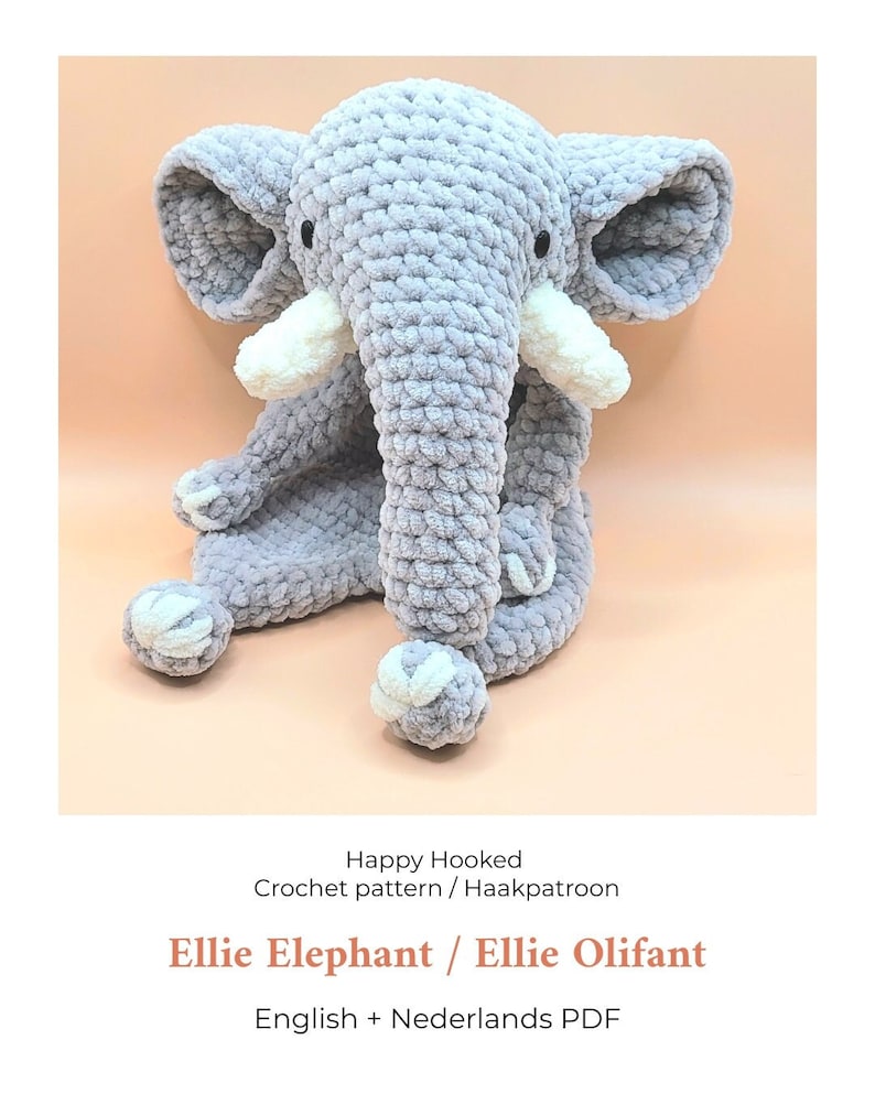May include: A crocheted gray elephant toy with white tusks and feet. The toy is sitting on a peach-colored background. The text "Happy Hooked Crochet pattern / Haakpatroon Ellie Elephant / Ellie Olifant English + Nederlands PDF" is below the toy.