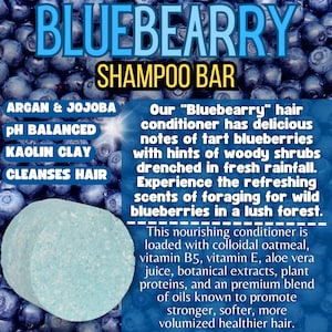 May include: Blue and white shampoo bar with the text "BLUEBEARRY SHAMPOO BAR" and "Our "Bluebearry" hair conditioner has delicious notes of tart blueberries with hints of woody shrubs drenched in fresh rainfall. Experience the refreshing scents of foraging for wild blueberries in a lush forest."  The bar is surrounded by blueberries.