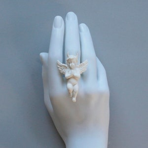 Ring with white angel and devil