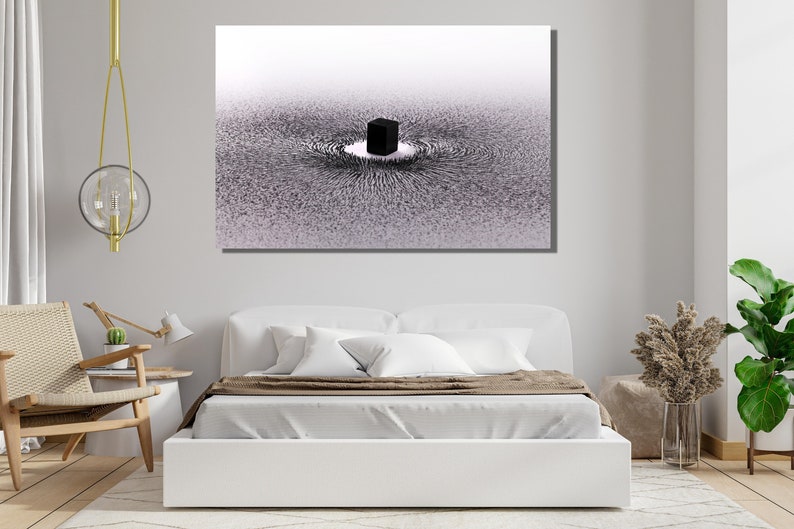May include: A black and white abstract art print depicting a black cube in the center of a swirling pattern of lines. The lines are arranged in a circular pattern around the cube, creating a sense of movement and energy.