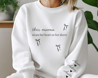 Custom This Mama Wears Her Heart On Her Sleeve Hoodie, Personalized Mom Sweatshirt With Kids Names, Cute Momma Outfit, Mothers Day Gifts