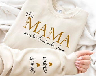 Custom This Mama Wears Her Heart On Her Sleeve Hoodie, Personalized Mom Sweatshirt With Kids Names, Cute Momma Outfit, Mothers Day Gifts