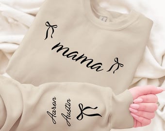 Custom This Mama Wears Her Heart On Her Sleeve Hoodie, Personalized Mom Sweatshirt With Kids Names, Cute Momma Outfit, Mothers Day Gifts