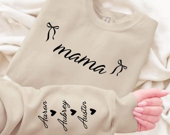 Custom This Mama Wears Her Heart On Her Sleeve Hoodie, Personalized Mom Sweatshirt With Kids Names, Cute Momma Outfit, Mothers Day Gifts