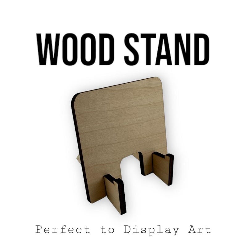 May include: A wooden stand with a light brown finish and black edges. The stand is designed to hold a piece of art or a photo upright. The stand is perfect for displaying artwork or photos on a desk or shelf.  "WOOD STAND" is written in black text at the top of the image.  "Perfect to Display Art" is written in black text at the bottom of the image.