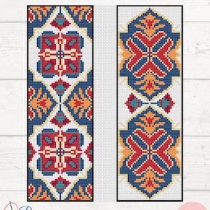 May include: Two vertical cross-stitch patterns featuring geometric motifs in blue, red, orange, and teal on a white grid. The left design displays repeating square floral shapes, while the right design shows elongated diamond-shaped ornaments.