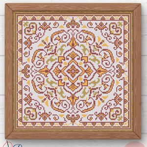 May include: A framed cross-stitch pattern with a symmetrical design in shades of yellow, brown, and green on a white background. The wooden frame surrounds the artwork. The text "Pura Creations" is in the lower left corner, and "PDF" is in the lower right corner.