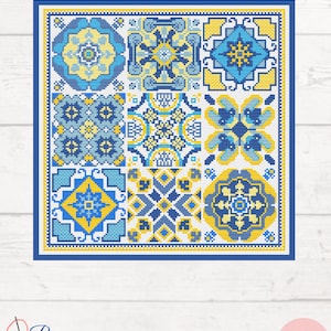 May include: Cross stitch pattern featuring a colorful geometric design with blue, yellow, and white tiles. The pattern is perfect for creating a decorative wall hanging or a unique piece of home decor.