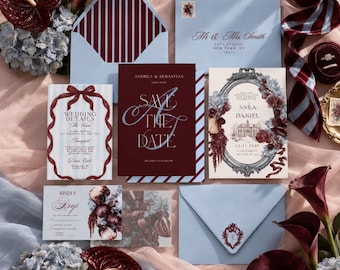 May include: A wedding stationery set featuring light blue and deep burgundy envelopes, cards with floral illustrations, and elegant typography. The cards include text such as Save The Date, Wedding Details, and RSVP, surrounded by decorative borders.