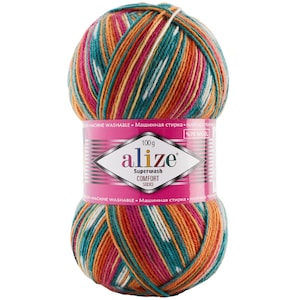 Peut inclure: Pelote de laine Alize Superwash Comfort Socks aux couleurs vives : teal, orange, rose et blanc. L'étiquette indique 100g et 75% de laine. Le fil est lavable en machine.