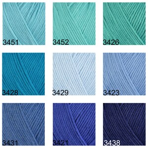 May include: Nine yarn skeins in various shades of blue and green. The skeins are arranged in a 3x3 grid. The numbers 3451, 3452, 3426, 3428, 3429, 3423, 3431, 3421, and 3438 are printed below each skein.