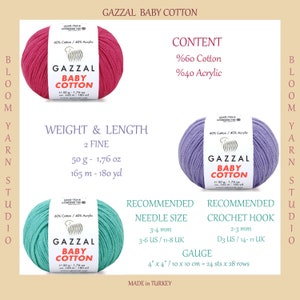 May include: Three skeins of yarn in pink, lavender, and teal colors. Each skein is labeled "GAZZAL BABY COTTON" and includes the yarn content, weight, length, and recommended needle and crochet hook sizes. The yarn is 60% cotton and 40% acrylic.