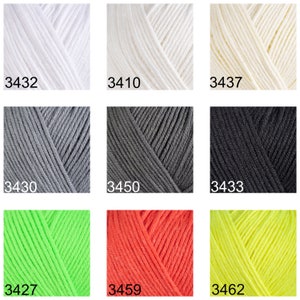 May include: Nine yarn skeins in various colors, including white, cream, gray, black, neon green, orange, and yellow. Each skein is labeled with a number, such as 3432, 3410, 3437, 3430, 3450, 3433, 3427, 3459, and 3462.