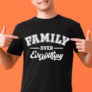 May include: A black t-shirt with white text that reads "Family Over Everything".