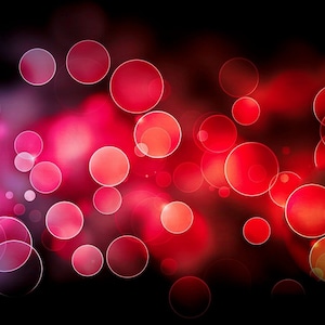 May include: Abstract background with a blurred effect of red and blue circles of light.