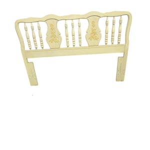 May include: Cream-colored wooden headboard with a decorative floral design. The headboard features a curved top with vertical spindles and carved floral accents. The headboard is designed to attach to a bed frame.