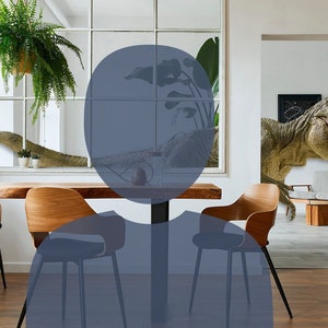 May include: A dining room with a wooden table and chairs. A large dinosaur mural is on the wall behind the table. The mural is of a Tyrannosaurus Rex with its mouth open.