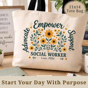 May include: A beige tote bag with black handles, featuring the words "Empower Social Worker" in a floral design. The bag is 21x14 inches and includes the words "Advocate" and "Support".
