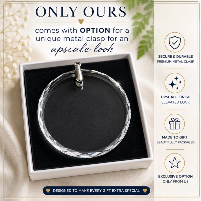 May include: A circular clear crystal ornament with a faceted edge and a silver-toned metal clasp, presented in a white box with a black velvet insert. Text includes ONLY OURS, OPTION, SECURE & DURABLE PREMIUM METAL CLASP, UPSCALE FINISH, MADE TO GIFT, and EXCLUSIVE OPTION.