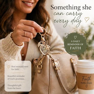 May include: A gold-colored keychain with a heart-shaped charm, cross, and keys. The keychain is held near a tan purse and a coffee cup with the words "Faith over fear." The image includes the text "Something she can carry every day.".