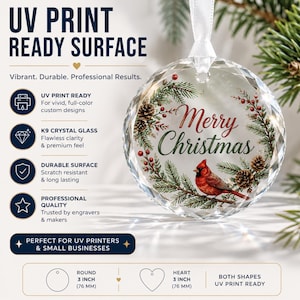 May include: A round, faceted K9 crystal glass ornament featuring a printed wreath of pine branches, pinecones, red berries, and a red cardinal bird with the text Merry Christmas. It includes a white ribbon and measures 3 inches in diameter.