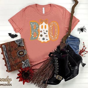 a t - shirt with the word boo on it