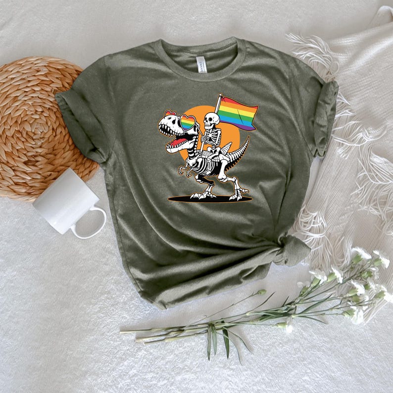 a t - shirt with a skeleton holding a rainbow flag