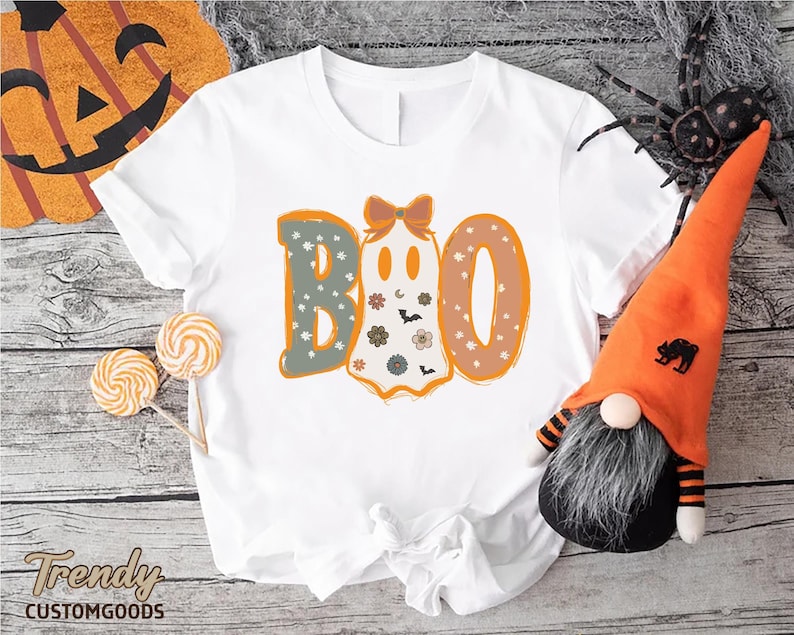 a white shirt with the word boo on it