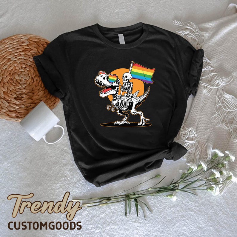 a skeleton riding a skateboard holding a rainbow flag